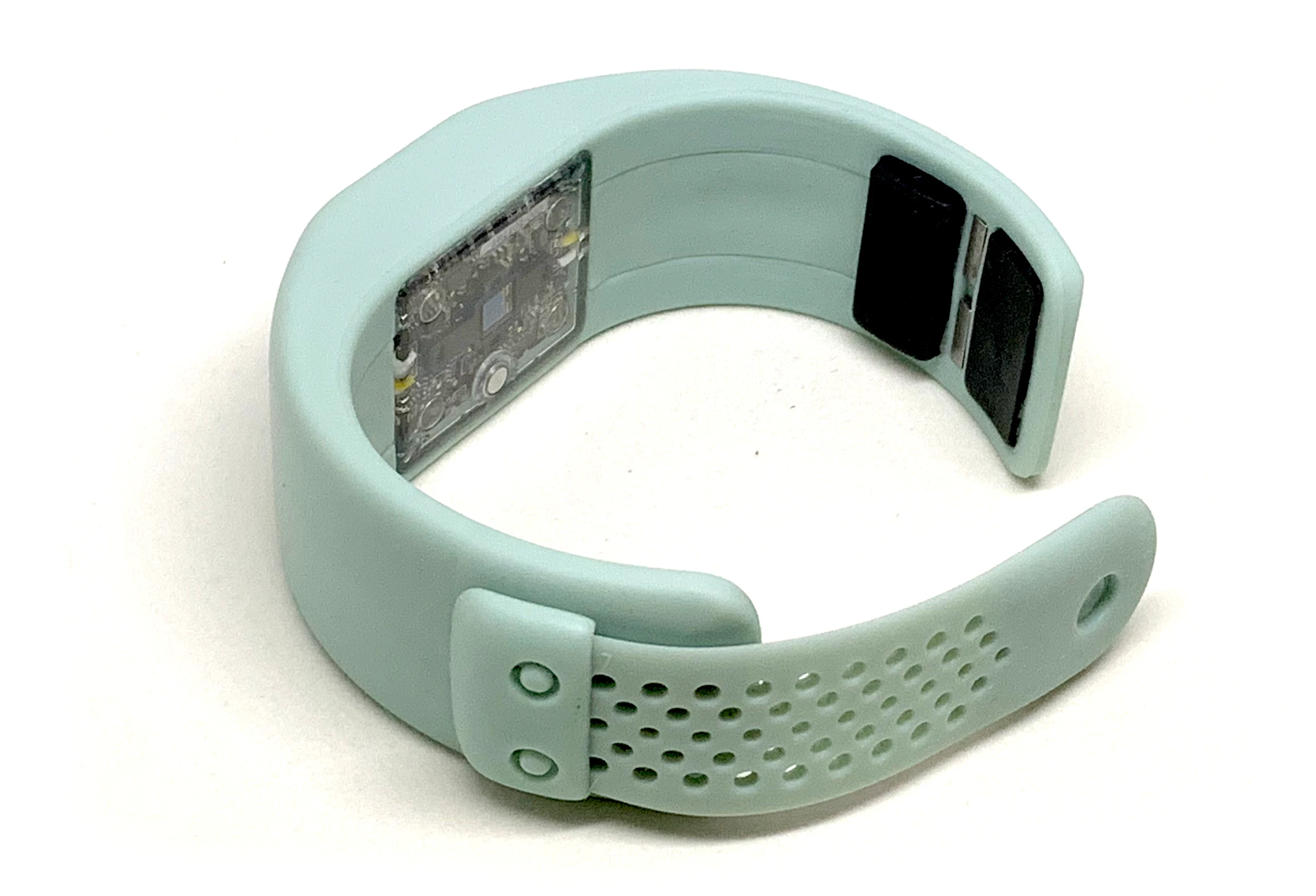 Sensor side of the CorBand showing its dry electrodes and optical sensing window
